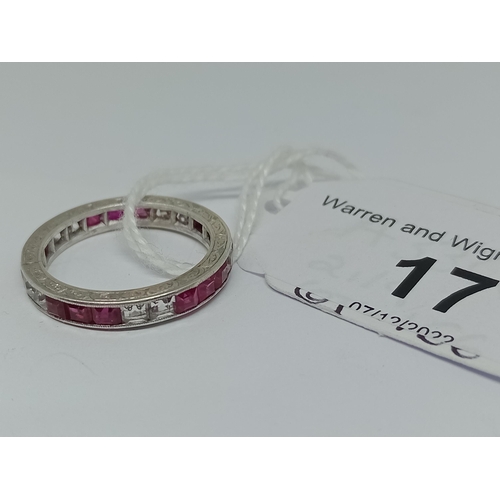22 - A synthetic ruby and sapphire full eternity ring, engraved outer edge, channel set princess cut ston... 
