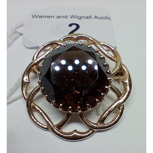 2 - A 9ct gold brooch with central smoky quartz stone, gross weight 9.8 grams.