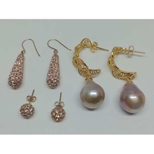 8 - Two pairs of 9ct gold and CZ earrings together with a pair of gilt silver baroque pearls earrings.