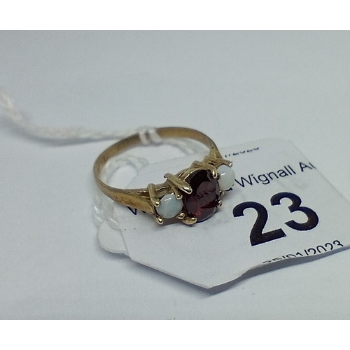 23 - A hallmarked 9ct gold garnet and opal ring, size L/M, gross wt. 1.77g.