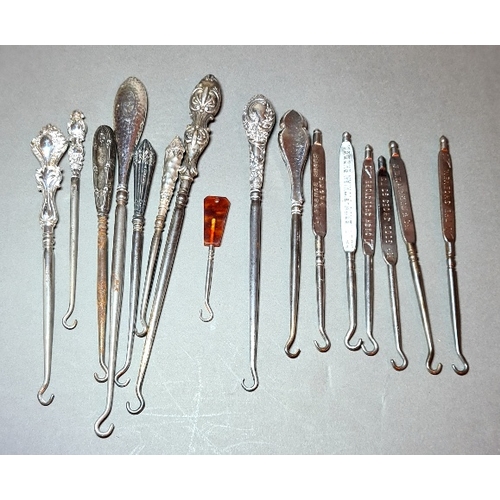 32 - A collection of 10 Victorian button hooks, most with silver handles and six Victorian advertising bu... 