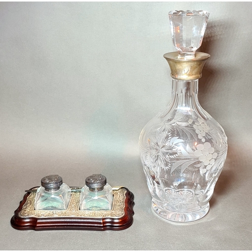 35 - An etched cut glass decanter with silver top together with a set of desk inkwells with silver tops o... 