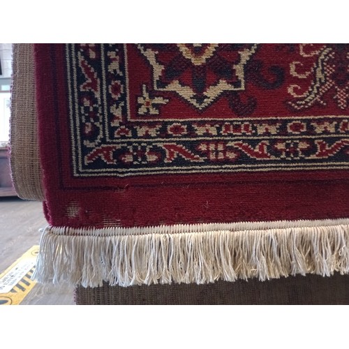 1063 - A Keshan style eastern wool carpet, red ground, 400cm x 300cm (approx).