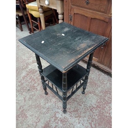 945 - A late Victorian Aesthetic Movement ebonised table in the manner of E W Godwin, together with a maho... 