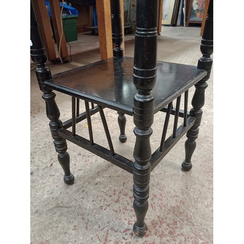 945 - A late Victorian Aesthetic Movement ebonised table in the manner of E W Godwin, together with a maho... 