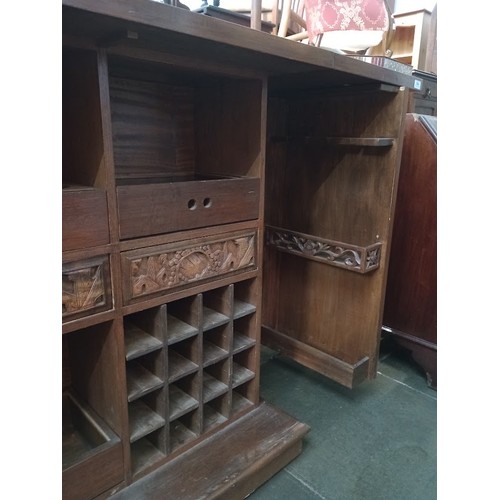 963 - A Chinese carved wood fold out cocktail cabinet/ bar.