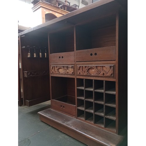 963 - A Chinese carved wood fold out cocktail cabinet/ bar.