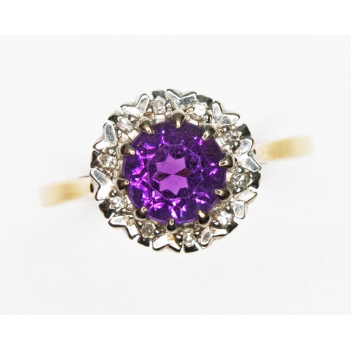 10 - An amethyst and diamond cluster ring, the round cluster measuring approx. 10.50mm in diameter, hallm... 