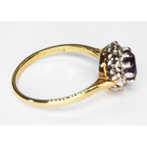 10 - An amethyst and diamond cluster ring, the round cluster measuring approx. 10.50mm in diameter, hallm... 