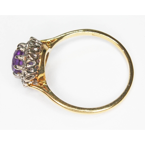 10 - An amethyst and diamond cluster ring, the round cluster measuring approx. 10.50mm in diameter, hallm... 