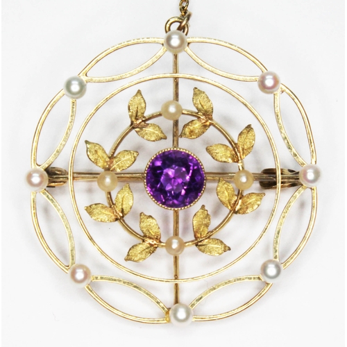 12 - An early 20th century pearl and amethyst brooch, diameter 30mm, marked '15ct', gross wt. 5.3g.