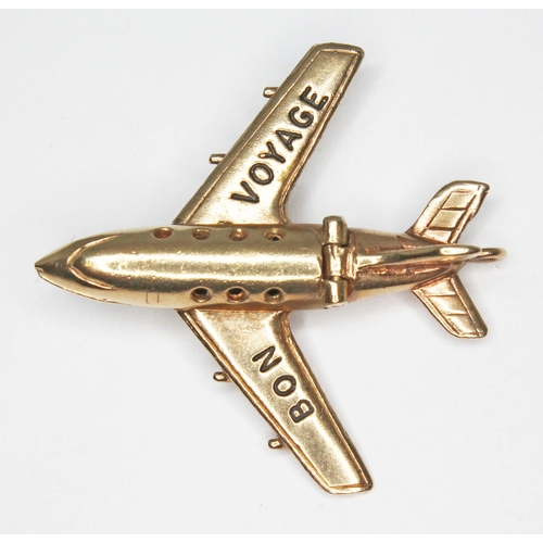 13 - A novelty pendant modelled as a jet plane and inscribed 'BON VOYAGE' to wings, hinged fuselage openi... 