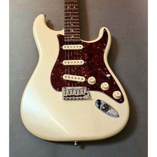 138 - A 2011 Fender Stratocaster, American made, serial no. US11278773, cream body with faux tortoiseshell... 