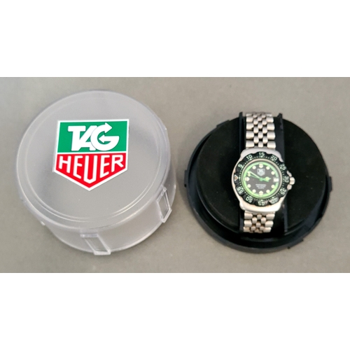 100 - A Tag Heuer Professional 200m quartz wristwatch, with box and papers.