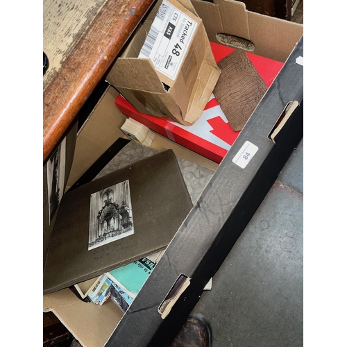 84 - A box of mixed ephemera, postcards, medals, tea cards etc