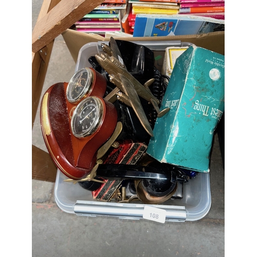 108 - A box of assorted items including model planes, telephone, met etcalware, Harmonica, glassware