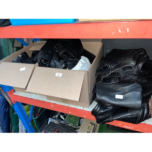 131 - 2 boxes and a bundle of motorcycle leathers to include trousers, jackets, gloves, helmet, etc