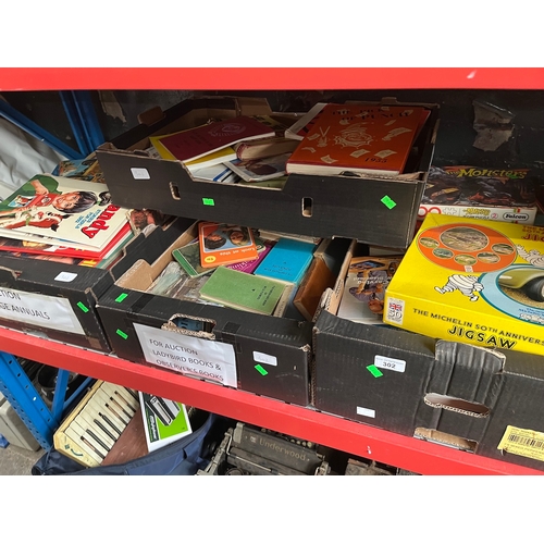 302 - 4 boxes of miscellaneous books and games