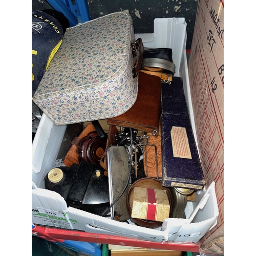 309 - A box and a case of various collectables to include leather wallets, cameras, magnifying glasses, le... 