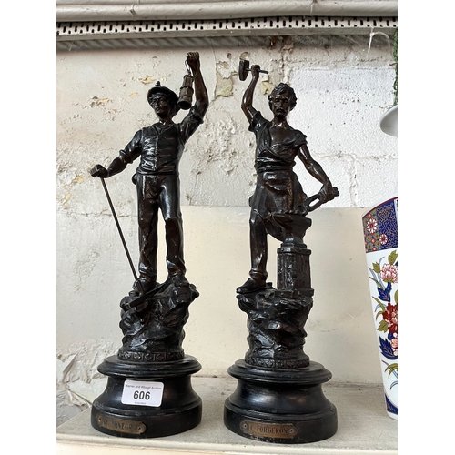 606 - A pair of spelter figures on wooden plinths - Le Mineur and Le Forgeron.