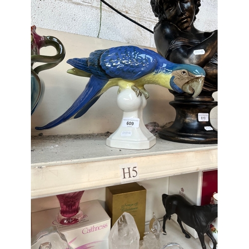 609 - A large Royal Dux blue macaw figure.