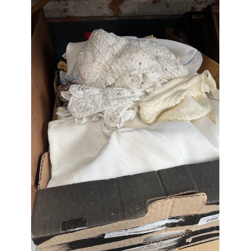 296 - A box of linen and crochet wares etc