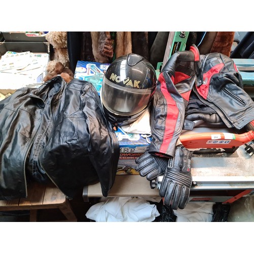 131 - 2 boxes and a bundle of motorcycle leathers to include trousers, jackets, gloves, helmet, etc