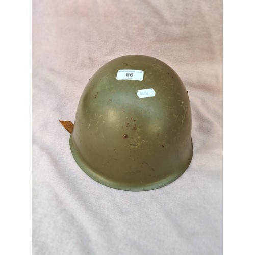 66 - A military helmet.