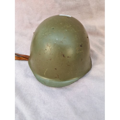 66 - A military helmet.