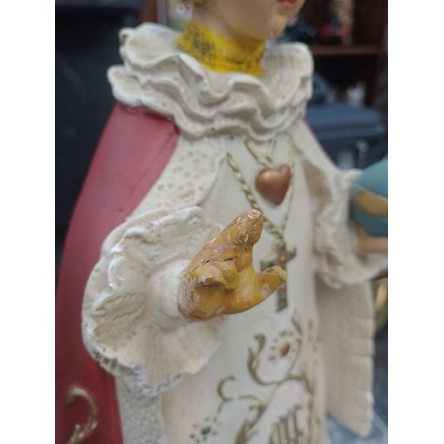 354 - Two religious plaster figures.