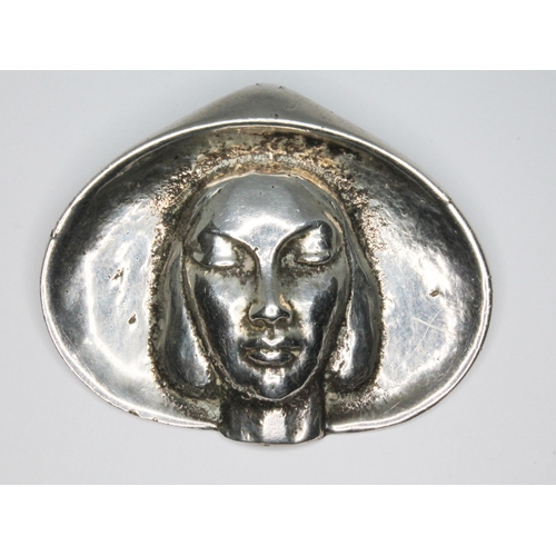 37 - A mid 20th century Modernist cast brooch depicting a lady wearing a hat, marked 'Silver', length 53m... 