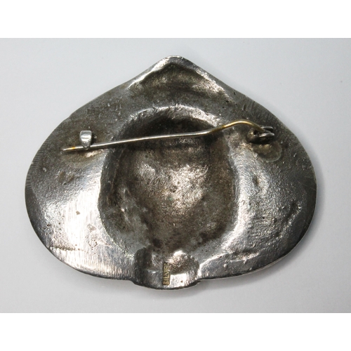 37 - A mid 20th century Modernist cast brooch depicting a lady wearing a hat, marked 'Silver', length 53m... 