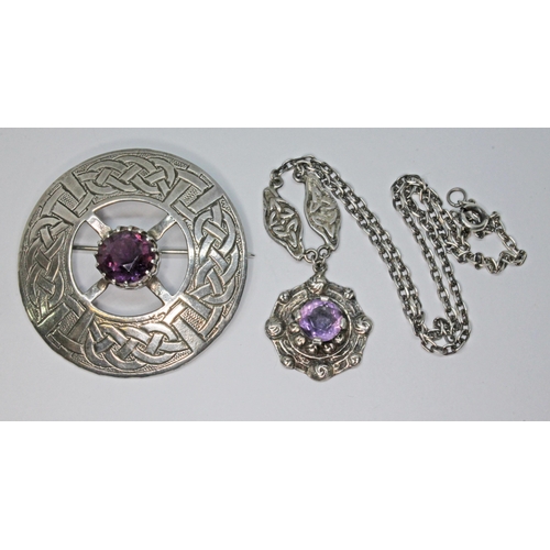 40 - Two pieces of Celtic style Scottish jewellery comprising an amethyst set target brooch marked 'Scotl... 