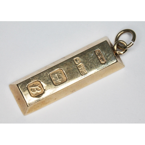 52 - A hallmarked 9ct gold ingot, length 30mm, wt. 10.3g.