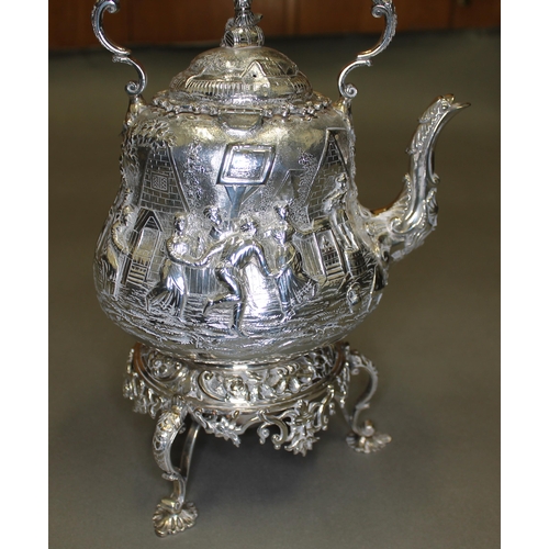 151 - A Victorian matched four piece silver tea set, decorated all over with in repousse depicting joyful ... 