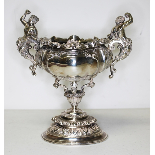 152 - A Victorian twin handled silver cup, decorated with classical figures, shells and scrolls, Carringto... 