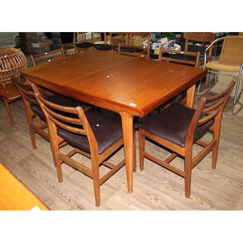 176 - A mid 20th century teak extending dining table and six chairs by Younger, length 145.5cm extending t... 