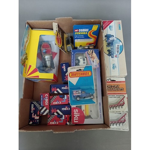 63 - A box of die cast model vehicles to include Corgi Juniors, Matchbox, a boxed Corgi Chitty Chitty Ban... 