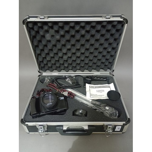 293 - A Tamashi camera with accessories in hard case.