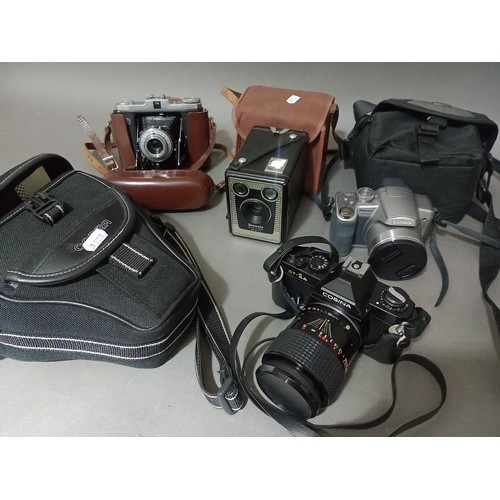 295 - A box of cameras to include Nettar Zeiss Ikon, Cosina CT-1A and Panasonic etc.