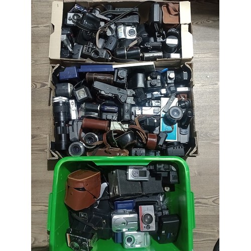 296 - 3 boxes of various cameras and accessories to include Polaroid, Cannon, Agfa, lenses, flash, binocul... 