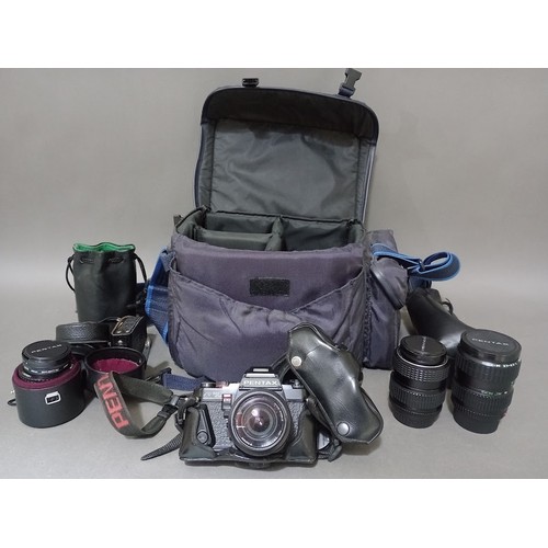 298 - A Pentax camera with various lenses in padded carry bag.