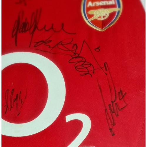 274 - A signed Arsenal f.c. shirt, a signed photo of Alan Shearer with other photos and a hutton youth tea... 