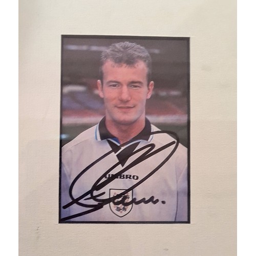 274 - A signed Arsenal f.c. shirt, a signed photo of Alan Shearer with other photos and a hutton youth tea... 