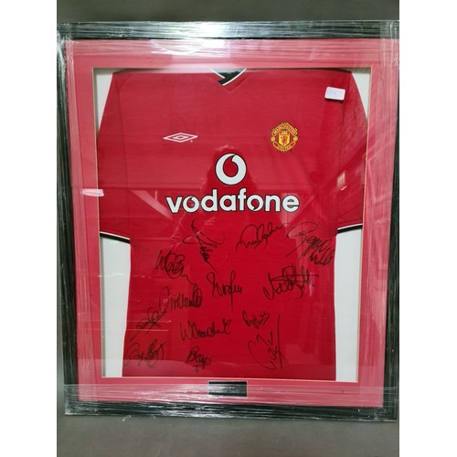 279 - 2 signed Manchester United f.c. shirts, framed and glazed.