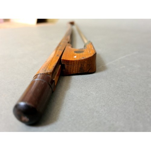 134 - A cello bow.