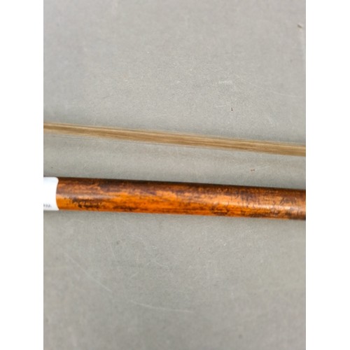 134 - A cello bow.