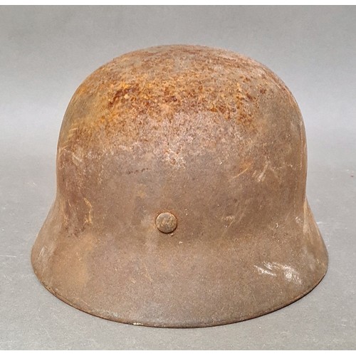 249 - A WW2 German M42 military steel helmet with some remnants of original paint on surface.