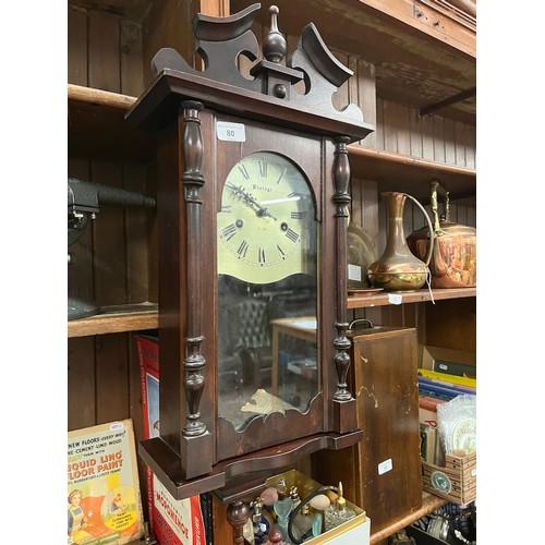 80 - A 31 day wall clock with pendulum and key.