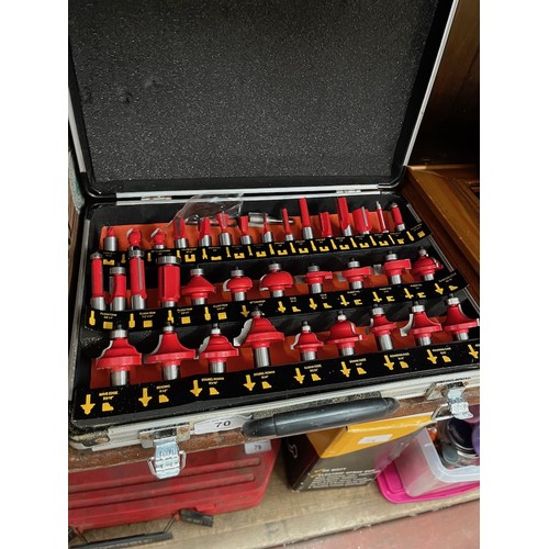 70 - A cased set of router bits.